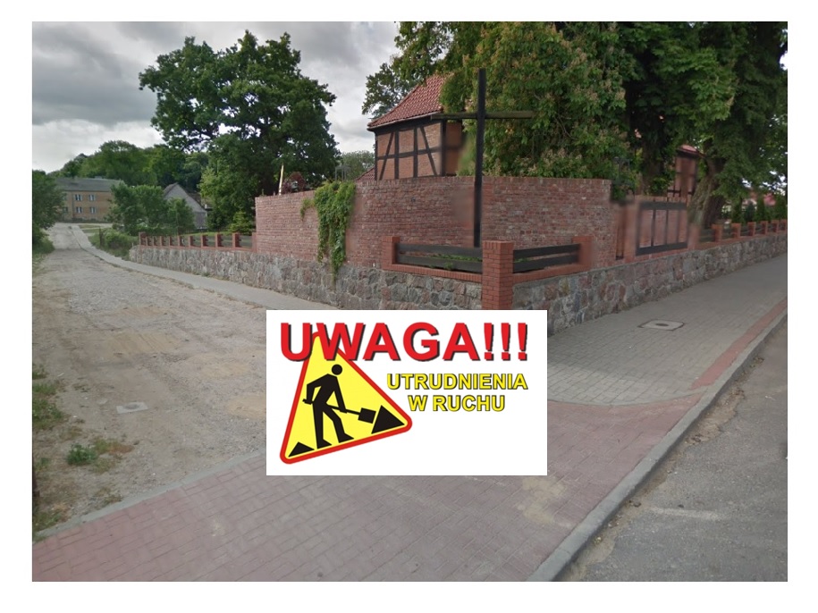 Widok na remontowaną drogę wraz z oznaczeniem Uwaga roboty drogowe